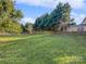 Spacious backyard with lush green grass and a wooden fence at 3309 Paxton Ridge Dr, Indian Trail, NC 28079