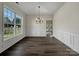 Formal dining room with hardwood floors, wainscoting, and chandelier at 3309 Paxton Ridge Dr, Indian Trail, NC 28079