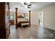 Spacious main bedroom with hardwood floors and an ensuite bathroom at 10235 Mount Holly Rd, Charlotte, NC 28214