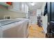 Convenient laundry room with washer, dryer, and ample storage at 10235 Mount Holly Rd, Charlotte, NC 28214