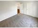 Bedroom with gray carpet and access to another room at 4432 Eaves Ln, Charlotte, NC 28215