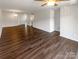 Spacious living room with hardwood floors and ceiling fan at 4432 Eaves Ln, Charlotte, NC 28215