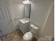 Updated bathroom features a vanity and toilet at 4432 Eaves Ln, Charlotte, NC 28215