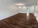Large living area with hardwood floors, neutral walls, and ample natural light at 4432 Eaves Ln, Charlotte, NC 28215