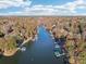 Aerial view of lakefront community with numerous houses and docks at 151 River Ridge Ln, Statesville, NC 28677