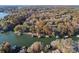 Aerial view of house on lake with a large backyard at 151 River Ridge Ln, Statesville, NC 28677