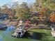 Aerial view of lakefront home with large dock and boat at 151 River Ridge Ln, Statesville, NC 28677