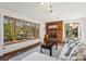 Living room with fireplace, large windows, and lake view at 151 River Ridge Ln, Statesville, NC 28677
