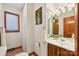 Clean and bright bathroom with wood vanity and a shower/tub combo at 151 River Ridge Ln, Statesville, NC 28677