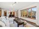 Open living space with lake views, sectional sofa, and dining area at 151 River Ridge Ln, Statesville, NC 28677