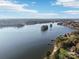 Aerial view of lakefront property with islands and houses at 151 River Ridge Ln, Statesville, NC 28677