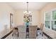 Dining room with a wooden table, wicker chairs, and a chandelier at 531 Tributary Dr # 26, Fort Lawn, SC 29714