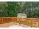 Wooden deck overlooking a backyard with trees and shed at 531 Tributary Dr # 26, Fort Lawn, SC 29714