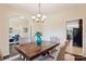 Dining room with a wooden table, wicker chairs, and a chandelier at 531 Tributary Dr # 26, Fort Lawn, SC 29714