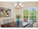 Dining room with a wooden table, wicker chairs, and a chandelier at 531 Tributary Dr # 26, Fort Lawn, SC 29714