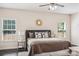 Main bedroom with a king-size bed, nightstands, and sunburst mirror at 531 Tributary Dr # 26, Fort Lawn, SC 29714