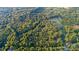 Aerial view of property with house and pond at 9224 Maggie Robinson Rd, Waxhaw, NC 28173