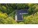 Aerial view of house with flat roof and green surroundings at 9224 Maggie Robinson Rd, Waxhaw, NC 28173