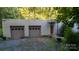 Modern two-car garage with neutral-colored doors at 9224 Maggie Robinson Rd, Waxhaw, NC 28173