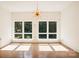 Sunlit dining room featuring large windows and hardwood floors at 9224 Maggie Robinson Rd, Waxhaw, NC 28173