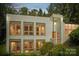 Evening view of a modern home with lighted windows at 9224 Maggie Robinson Rd, Waxhaw, NC 28173