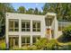 Contemporary home's exterior, featuring expansive windows and stucco siding at 9224 Maggie Robinson Rd, Waxhaw, NC 28173