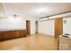 Small basement kitchenette with wood cabinets at 9224 Maggie Robinson Rd, Waxhaw, NC 28173