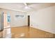 Empty bedroom with door to exterior and neutral walls at 9224 Maggie Robinson Rd, Waxhaw, NC 28173