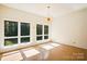Bright dining room with large windows and a unique chandelier at 9224 Maggie Robinson Rd, Waxhaw, NC 28173