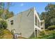 Modern home exterior with stucco siding and large windows at 9224 Maggie Robinson Rd, Waxhaw, NC 28173