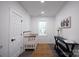 Bright Bedroom with crib, window, and stylish decor at 615 English St, Monroe, NC 28110