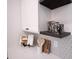 White shaker cabinets, dark wood shelves, and geometric backsplash at 615 English St, Monroe, NC 28110