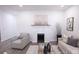 Bright living room with white fireplace, comfortable seating, and large windows at 615 English St, Monroe, NC 28110