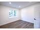Spacious bedroom with large window and hardwood floors at 615 English St, Monroe, NC 28110
