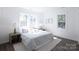 Spacious bedroom with a king-size bed and large windows at 615 English St, Monroe, NC 28110