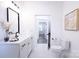 Bright bathroom features a white vanity, walk-in shower, and an open floor plan at 615 English St, Monroe, NC 28110