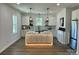 Modern kitchen with white cabinets and center island at 615 English St, Monroe, NC 28110