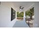 Front porch view with ceiling fan and yard view at 615 English St, Monroe, NC 28110