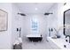 Elegant bathroom with a clawfoot tub, double shower heads, and modern fixtures at 615 English St, Monroe, NC 28110