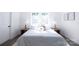 Bright bedroom with a king-size bed and wood flooring at 615 English St, Monroe, NC 28110
