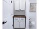 Clean bathroom with white cabinets, wood countertop and toilet at 615 English St, Monroe, NC 28110
