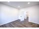 Bright bedroom with hardwood floors and access to other rooms at 615 English St, Monroe, NC 28110