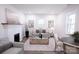 Spacious living room with a fireplace and plenty of natural light at 615 English St, Monroe, NC 28110