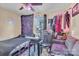 Small bedroom with twin bed, couch, and clothing rack at 114 Gregg W St, Fort Mill, SC 29715