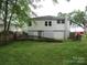 Back of house with yard and wooden fence at 1146 Buffalo St, Shelby, NC 28150