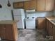 Kitchen with white appliances and wood cabinets at 1146 Buffalo St, Shelby, NC 28150