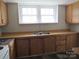 Kitchen with wood cabinets and double sink at 1146 Buffalo St, Shelby, NC 28150