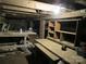 Unfinished basement with workbench and shelving at 1146 Buffalo St, Shelby, NC 28150