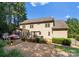Large backyard with patio, deck, and mature trees at 124 Streamwood Rd, Troutman, NC 28166