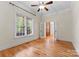 Bedroom with hardwood floors, french doors, and a window at 124 Streamwood Rd, Troutman, NC 28166